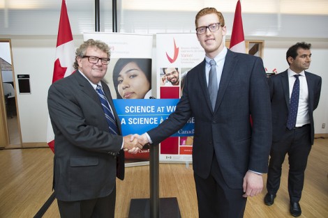 The Honourable Ed Holder, minister of state for science & technology (left) and Miles Montgomery, 2014 Vanier winner and PhD candidate in chemical engineering and applied chemistry (right) at the announcement of the 2014 Vanier Canada Graduate Scholarships and Banting Postdoctoral Fellowships . PHOTO COURTESY OF U OF T NEWS