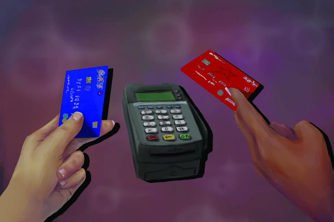 a debit machine in between two different people's hands, both holding debit cards